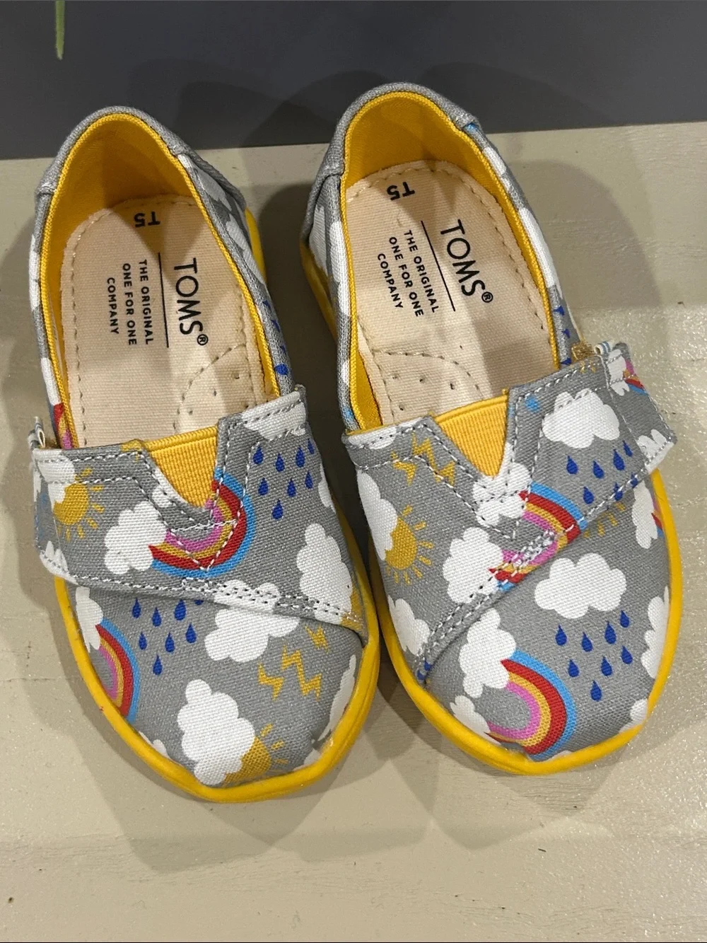 TOMS Kids Gray Canvas Slip-On Shoes with Rainbow & Yellow Trim